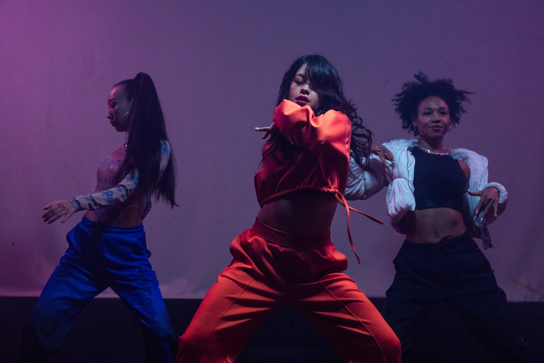 photo of three women dancing